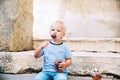 Child boy with Fritule - Croatian sweet pastry, cookies, homemade fritters Royalty Free Stock Photo