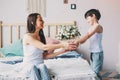 Child boy giving flowers to mom in the morning for mothers day Royalty Free Stock Photo