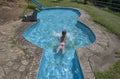 Child boy at guitar-shaped swimming pool, Losar de la Vera, Spain Royalty Free Stock Photo