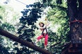 Child boy having fun at adventure park. Child climbing on high rope park. Happy little child climbing on a rope Royalty Free Stock Photo