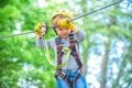 Child boy having fun at adventure park. Happy child climbing in the trees. Happy Little child climbing a tree. Balance Royalty Free Stock Photo