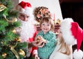 Child boy helps mother and father to decorate Royalty Free Stock Photo