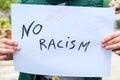 Child boy hold a paint draw for support no racism protest in usa,no racism,education Royalty Free Stock Photo