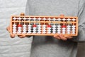 Child boy with Japanese traditional abacus soroban on white background