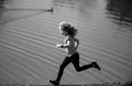 Child boy jogging in park outdoor. Sporty kid running in nature. Active healthy child boy runner jogging outdoor. Active