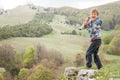 Child boy looking through binocular to the country side