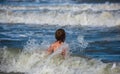 Child boy in nature with beautiful sea, sand and blue sky. Happy child playing in the sea. Royalty Free Stock Photo