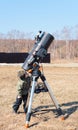 Child boy near big black telescope on a tripod at the observatory for observation of stars and planets. Science