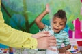 Child boy playing with chemical liquid. Royalty Free Stock Photo