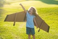 Child boy playing and dreaming about summer vacation and travel. Kids imagination and freedom concept. Kid having fun Royalty Free Stock Photo