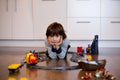 Child boy playing in living room with a toy train Royalty Free Stock Photo