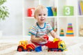 Child boy playing with toy car Royalty Free Stock Photo