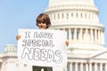 Protester boy holding sign I have special needs Royalty Free Stock Photo