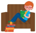 Child boy reading a book sitting in a chair Royalty Free Stock Photo