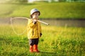 Child boy ready for fishing. Cute little boy in hat holding big fishing net at the ready Royalty Free Stock Photo