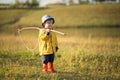 Child boy ready for fishing. Cute little boy in hat holding big fishing net at the ready. Royalty Free Stock Photo