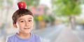 Child boy with red apple fruit on his head town banner copyspace copy space healthy eating concept Royalty Free Stock Photo