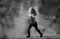 Child boy running or jogging near lake on grass in park. Sporty boy runner running in summer park. Active kids, sport Royalty Free Stock Photo