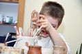 Child boy shaping clay in pottery studio