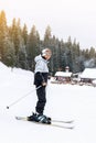 Child boy skier on ski slope of winter mountain resort Pamporovo, Bulgaria. Christmas holiday, family vacation outdoor Royalty Free Stock Photo