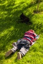 Child boy sleeping in grass Royalty Free Stock Photo