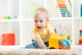 Child boy toddler playing with toy car Royalty Free Stock Photo