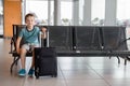 Child boy waiting in waiting room for passengers Royalty Free Stock Photo