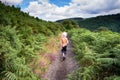Child walking on nature path, Dartmoor, England