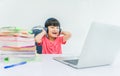 Child boy wear headphone and enjoy listening music by laptop computer Royalty Free Stock Photo