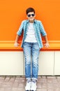 Child boy wearing a sunglasses and shirt in city Royalty Free Stock Photo
