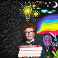 Child boy 9 years old looking at lightbulb, science and arts scetch background. Brainstorming, idea and choice Royalty Free Stock Photo