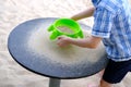 Child, boy of 6-8 years plays in summer with sand on seashore, in sandbox, on playground, concept of development of fine motor Royalty Free Stock Photo