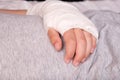 A child broken arm in plaster case, hand injury because of accident, forearm bones fracture