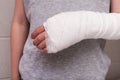 A child broken arm in plaster case, hand injury because of accident, forearm bones fracture