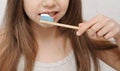 Child brushes teeth with bamboo brush. Royalty Free Stock Photo