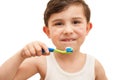 Child brushing teeth isolated