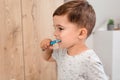 Child brushing teeth. Kids tooth brush and paste. Little funny baby boy brushing his teeth in modern bathroom on sunny Royalty Free Stock Photo