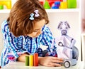 Child build robot toy. Kid engaged robotics in programming classes. Royalty Free Stock Photo
