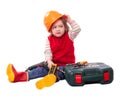 Child in builder hardhat with working tools Royalty Free Stock Photo