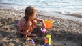 Child Building Castle on Beach at Sunset, Kid Playing Sands on Seashore, Girl Portrait on Seaside, Ocean View, Happy Children Royalty Free Stock Photo