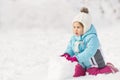 Child building snowman Royalty Free Stock Photo