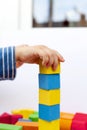 A child builds a pyramid of cubes Royalty Free Stock Photo