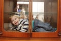 Child in built-in closet Royalty Free Stock Photo