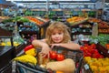 Child buying fruit in supermarket. Kid buy fresh vegetable in grocery store. Kids in shop, healthy food. Little child Royalty Free Stock Photo