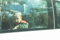 Child through a car window Royalty Free Stock Photo