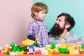 Child care concept. Happy family. Child development and upbringing. Father and son have fun with bricks. Fathers day Royalty Free Stock Photo