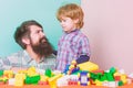 Child care concept. Happy family. Child development and upbringing. Father and son have fun with bricks. Fathers day Royalty Free Stock Photo