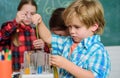 Child care and development. School classes. Kids adorable friends having fun in school. School chemistry lab concept Royalty Free Stock Photo