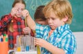 Child care and development. School classes. Kids adorable friends having fun in school. School chemistry lab concept Royalty Free Stock Photo