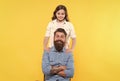 Because of child care matters. Happy child and father yellow background. Little child and bearded man. Family relations Royalty Free Stock Photo